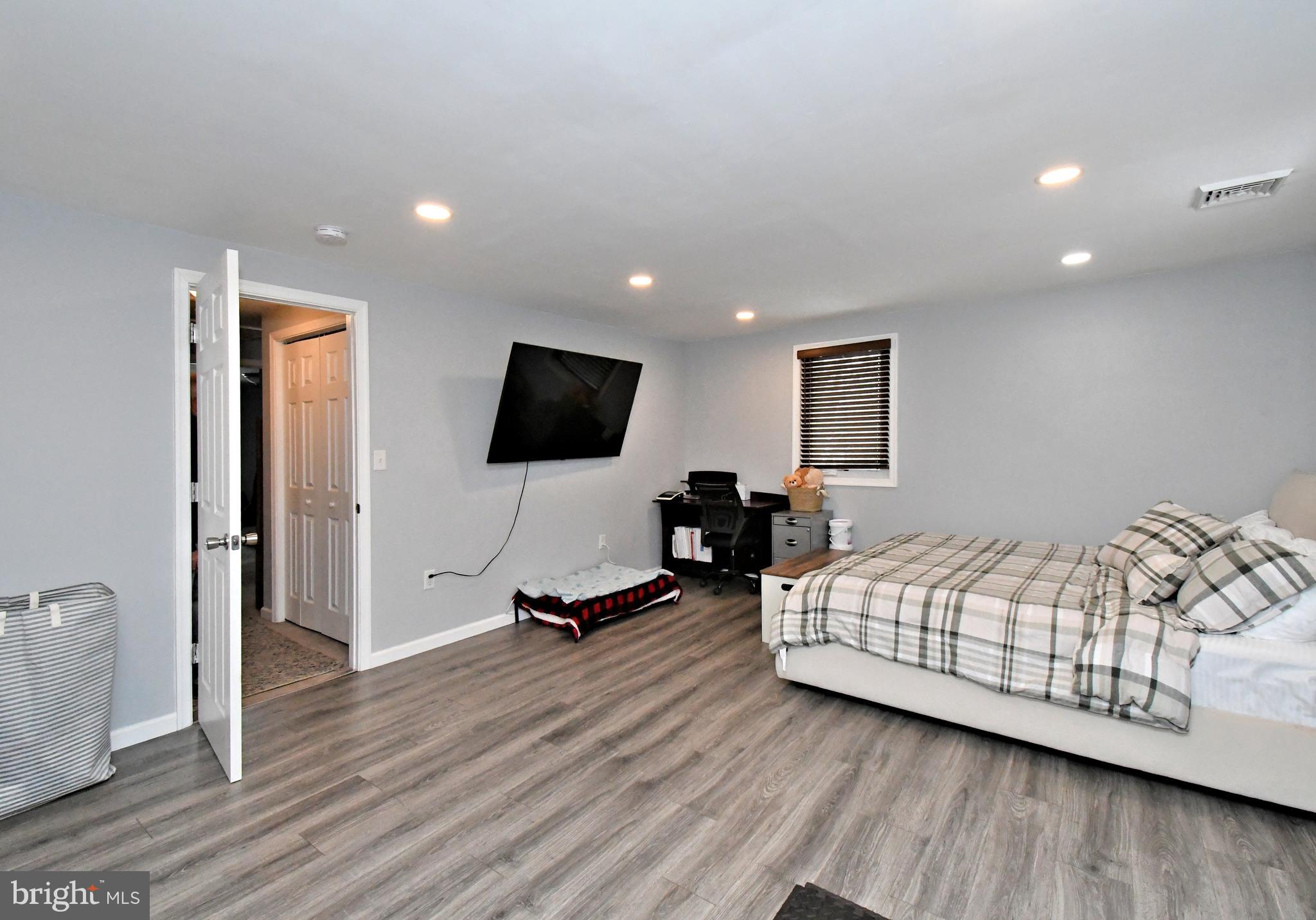 510 North Pleasantview Road Pottstown, PA 19464 - Photo 23 of 37 a bedroom with furniture window and a flat screen tv