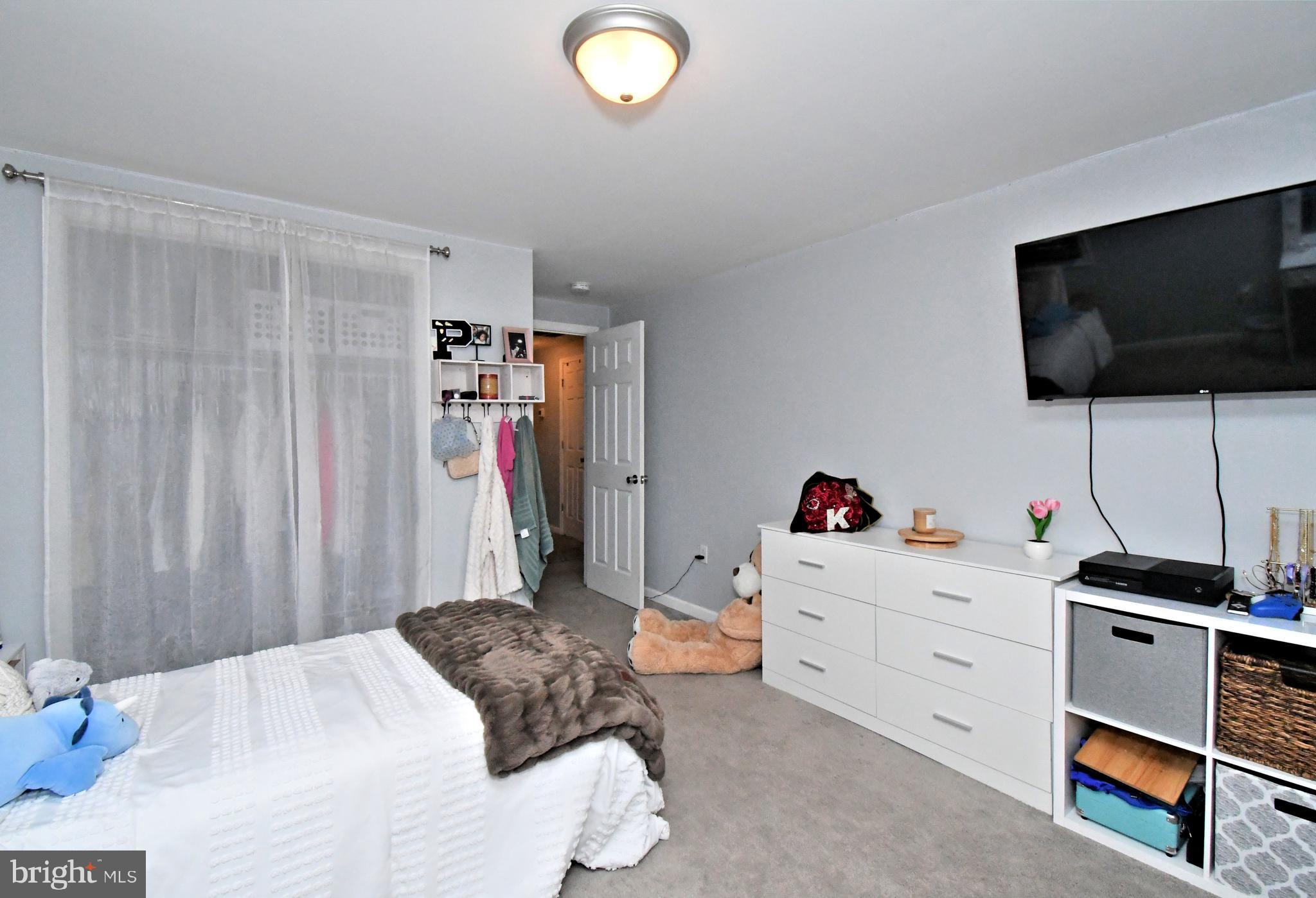 510 North Pleasantview Road Pottstown, PA 19464 - Photo 26 of 37 a bedroom with a bed and a flat screen tv