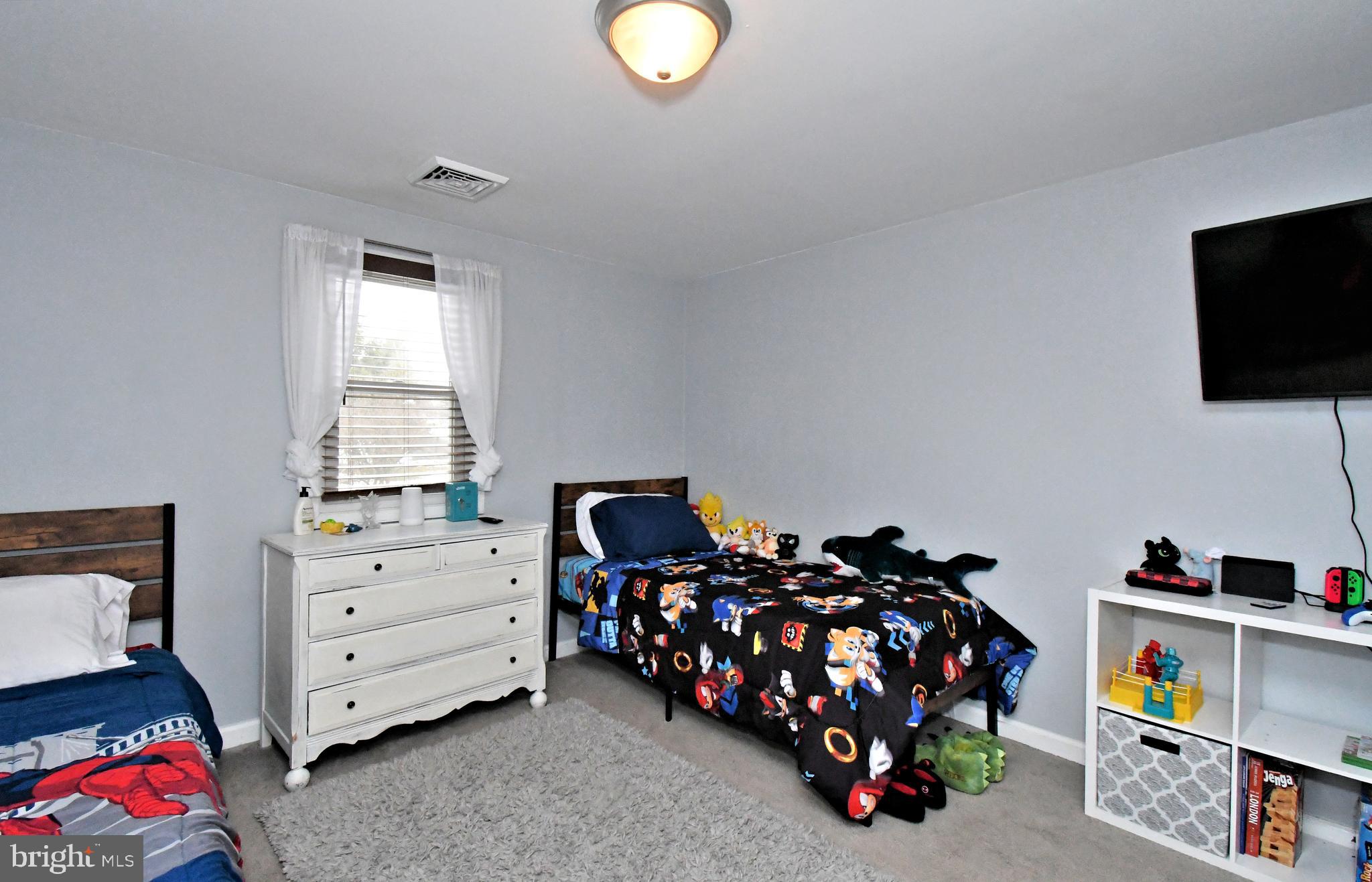 510 North Pleasantview Road Pottstown, PA 19464 - Photo 30 of 37 a bedroom with furniture a flat screen tv and a window