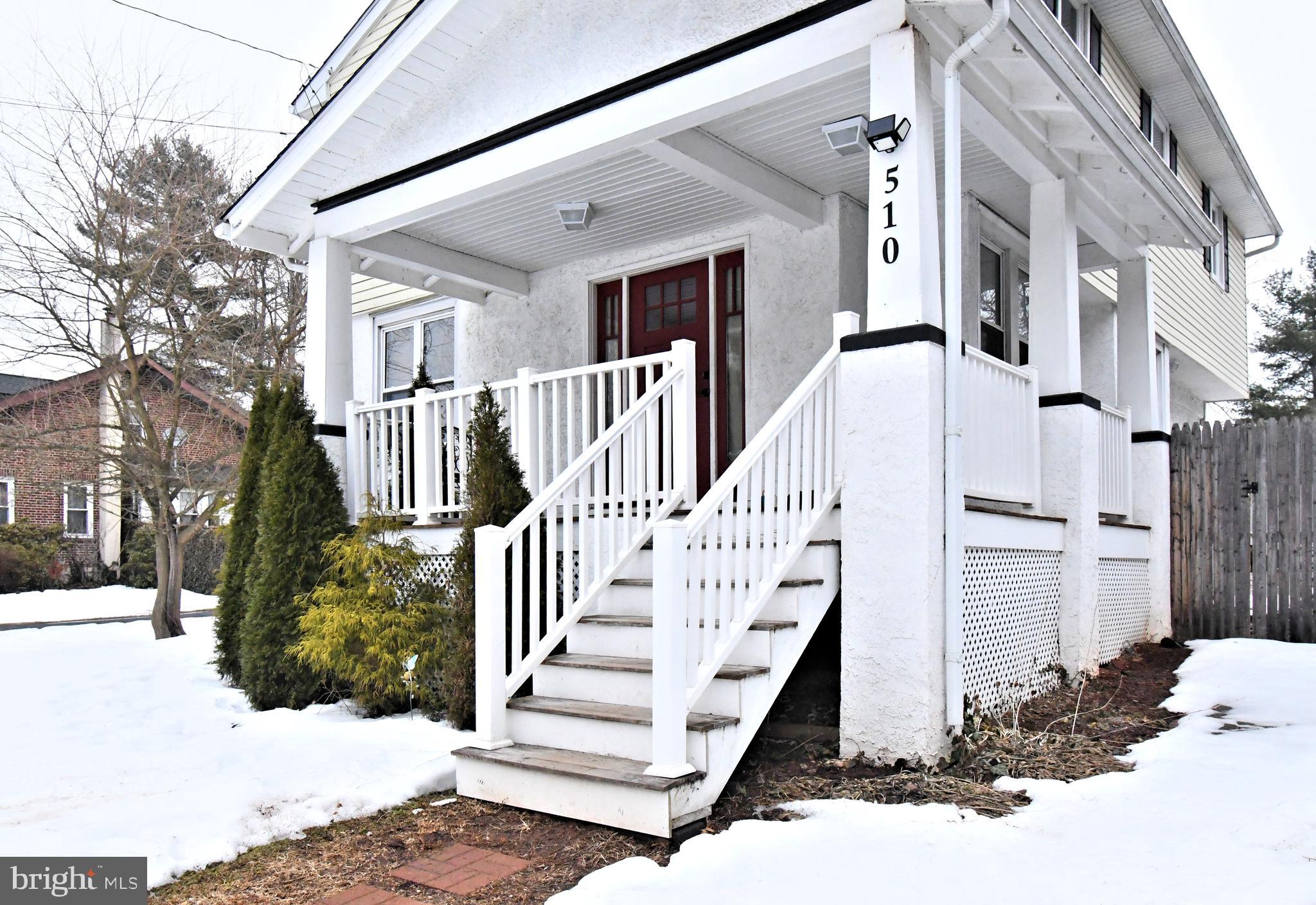 510 North Pleasantview Road Pottstown, PA 19464 - Photo 3 of 37 a view of a white house with a small yard and wooden fence