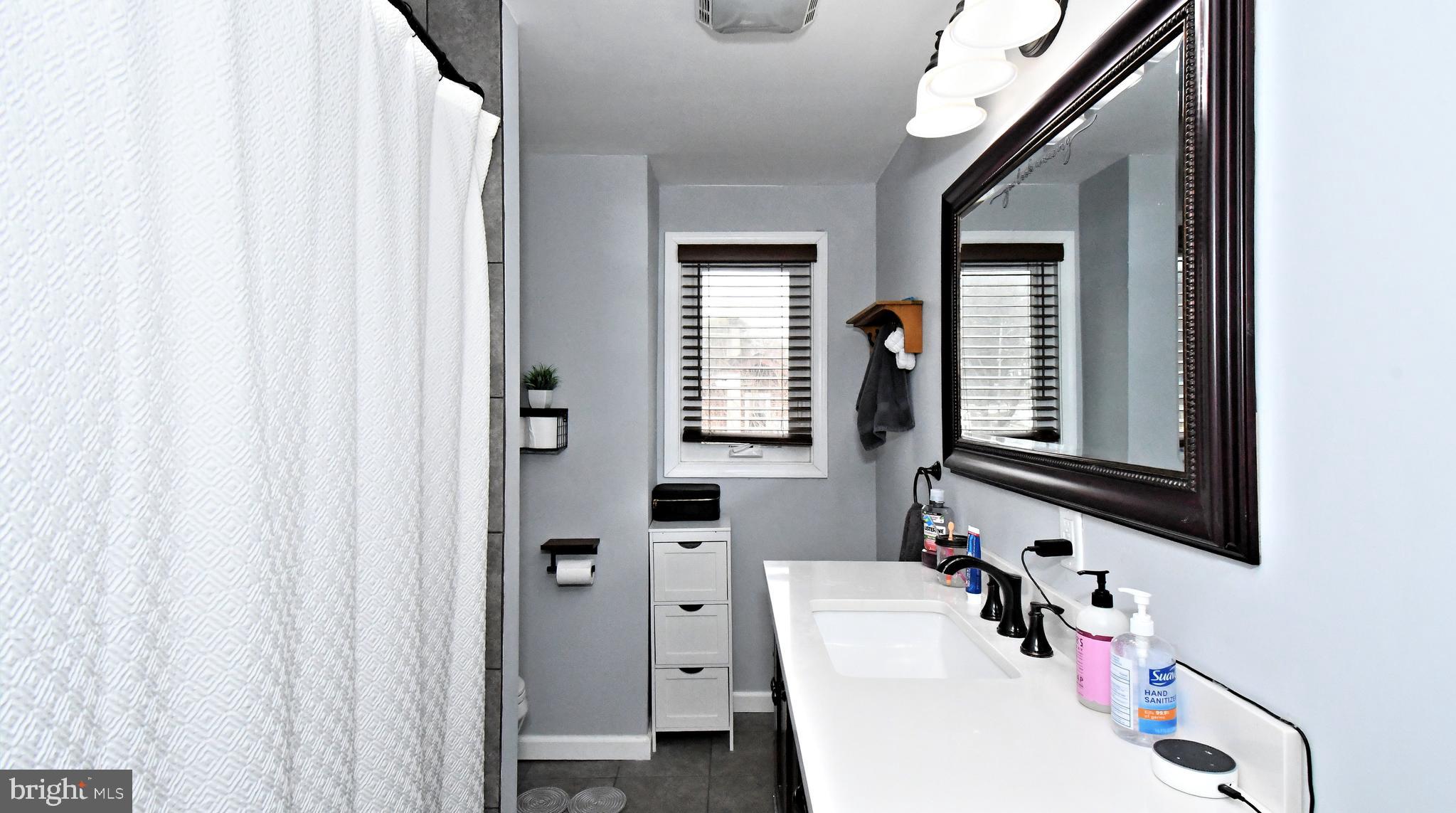 510 North Pleasantview Road Pottstown, PA 19464 - Photo 31 of 37 a bathroom with a sink and a mirror