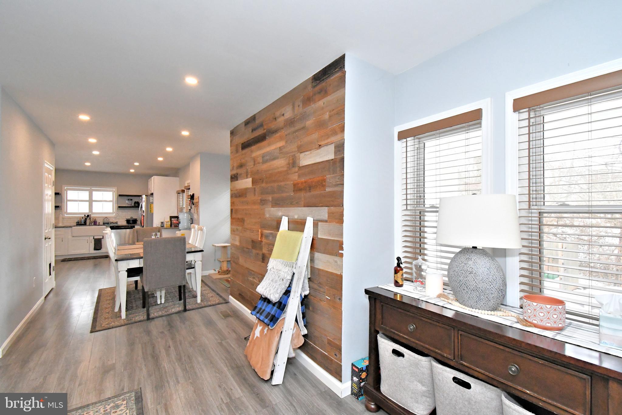 510 North Pleasantview Road Pottstown, PA 19464 - Photo 5 of 37 a view of a dining room with furniture wooden floor and a large window