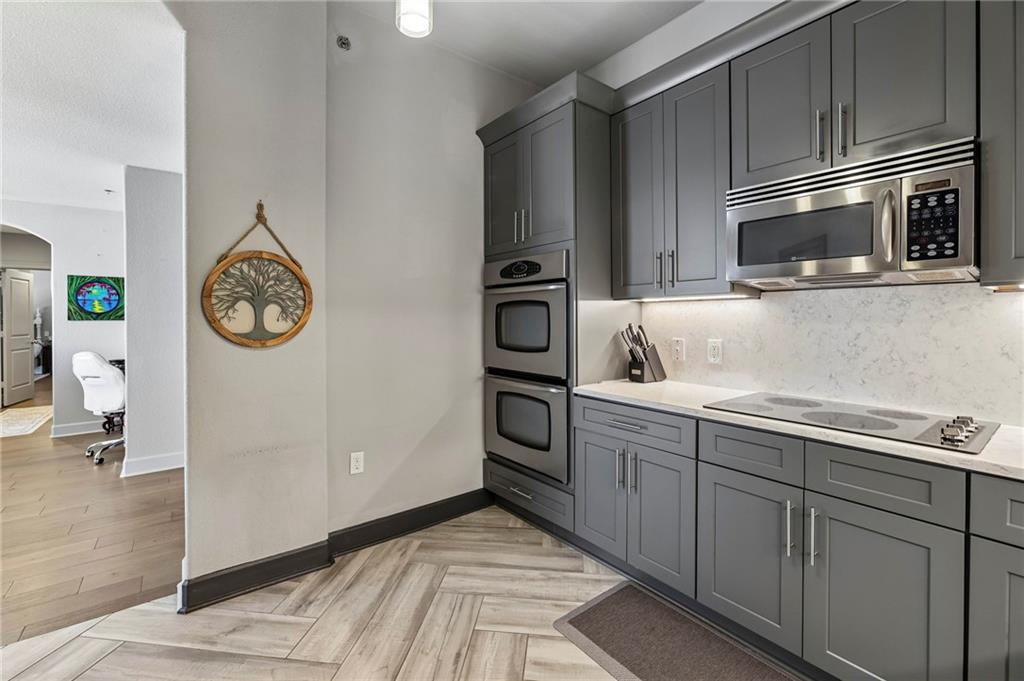3445 Stratford Road Northeast, Unit 3105 Atlanta, GA 30326 - Photo 9 of 47 a kitchen with a refrigerator and a microwave