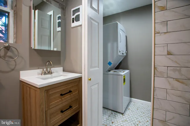a bathroom with a sink a toilet and mirror