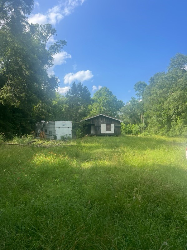 0 Broze Road Humble, TX 77338 - Photo 13 of 25 a front view of a house with a yard