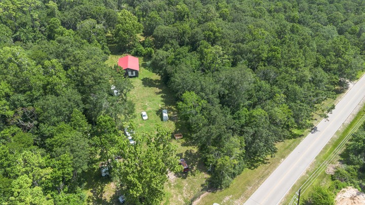 0 Broze Road Humble, TX 77338 - Photo 18 of 25 a backyard of a house with a yard and potted plants