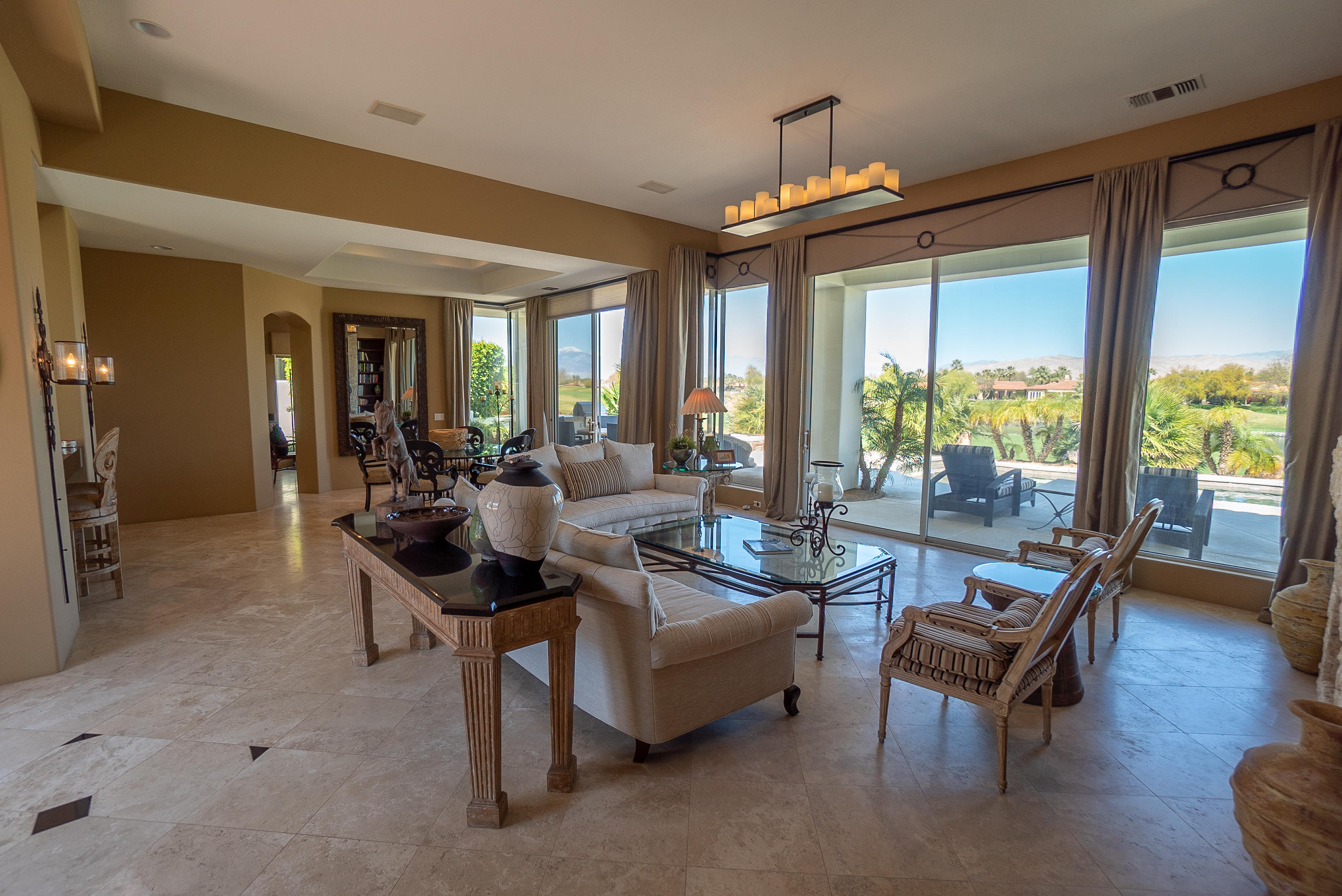 144 Loch Lomond Road Rancho Mirage, CA 92270 - Photo 11 of 28 a living room with furniture and a large window