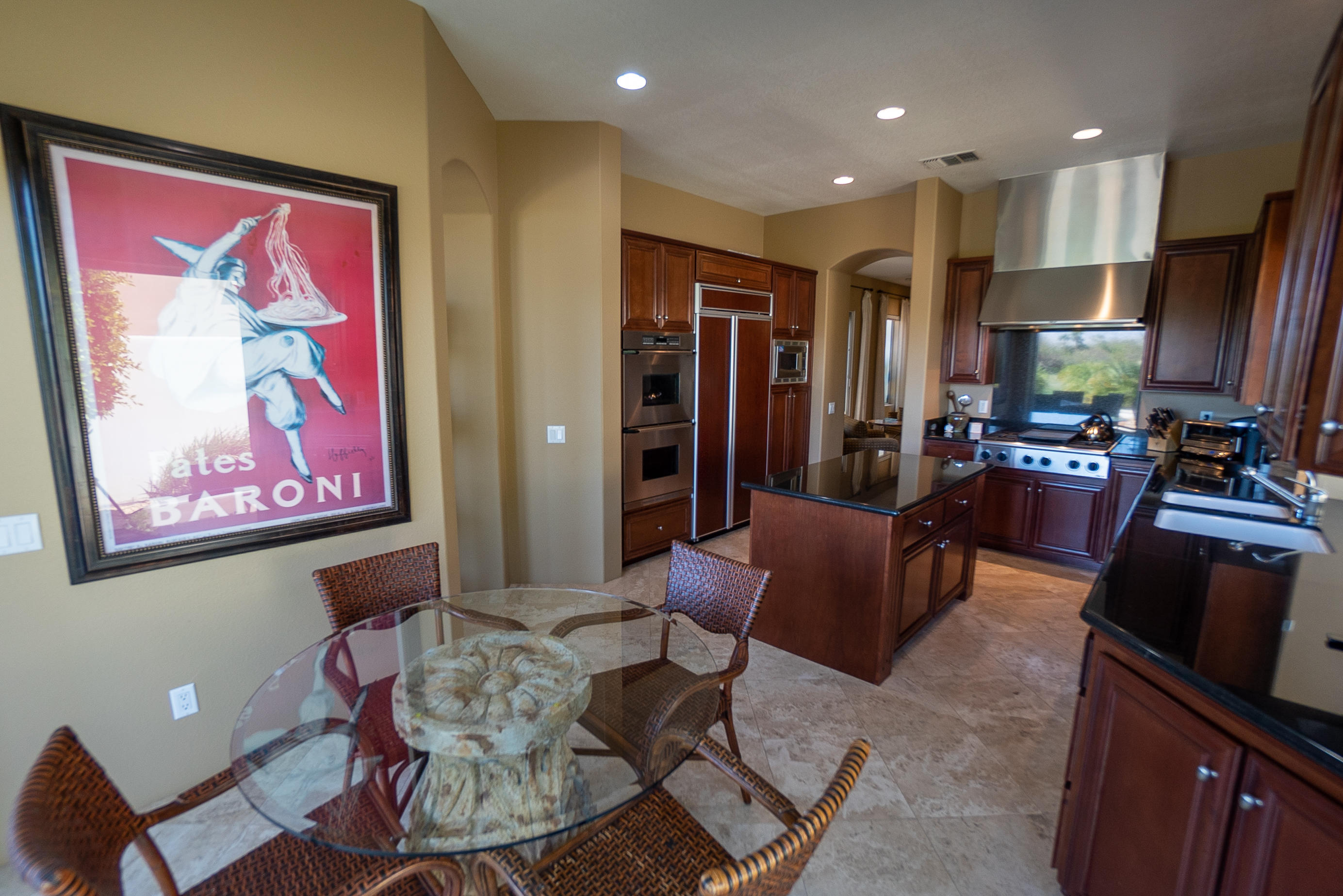 144 Loch Lomond Road Rancho Mirage, CA 92270 - Photo 12 of 28 a living room with furniture a dining table and kitchen view