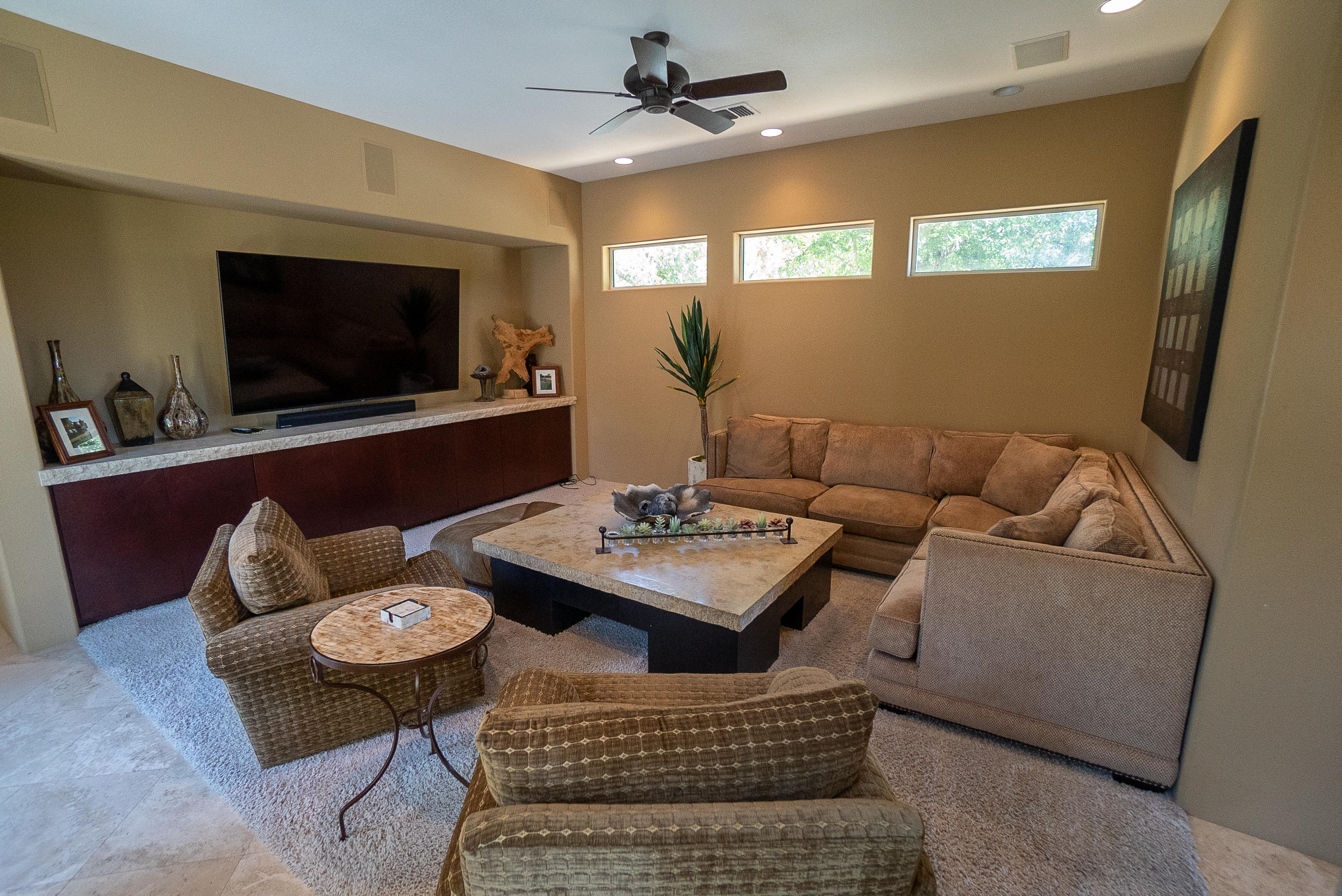 144 Loch Lomond Road Rancho Mirage, CA 92270 - Photo 15 of 28 a living room with furniture and a flat screen tv