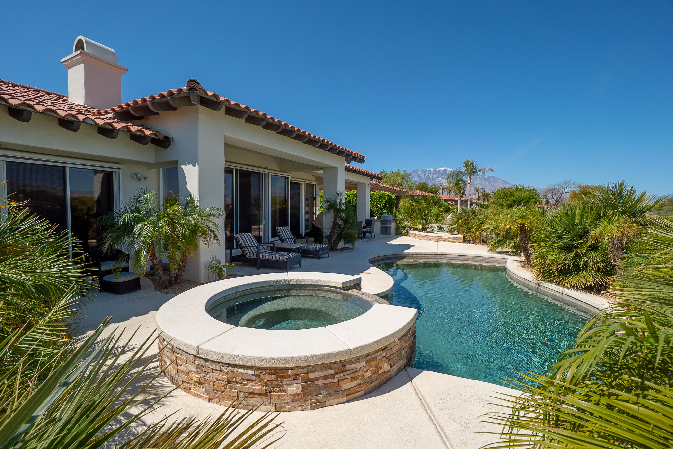 144 Loch Lomond Road Rancho Mirage, CA 92270 - Photo 8 of 28 a view of house with swimming pool outdoor seating