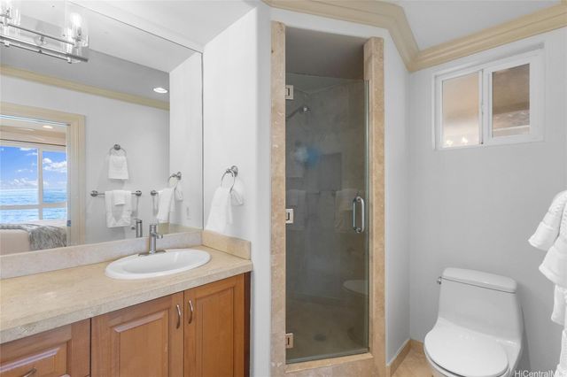 a bathroom with a sink toilet a mirror and shower