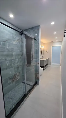 a very nice looking room with a glass door shower