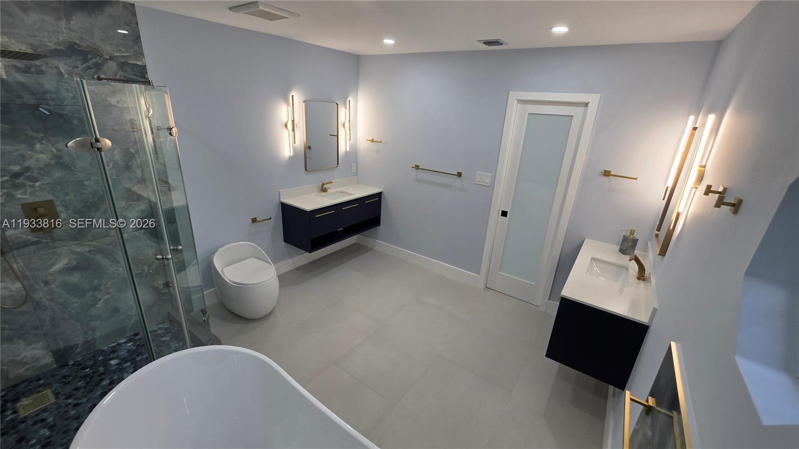 10540 Southwest 125th Street Miami, FL 33176 - Photo 14 of 31 a bathroom with a toilet sink and shower