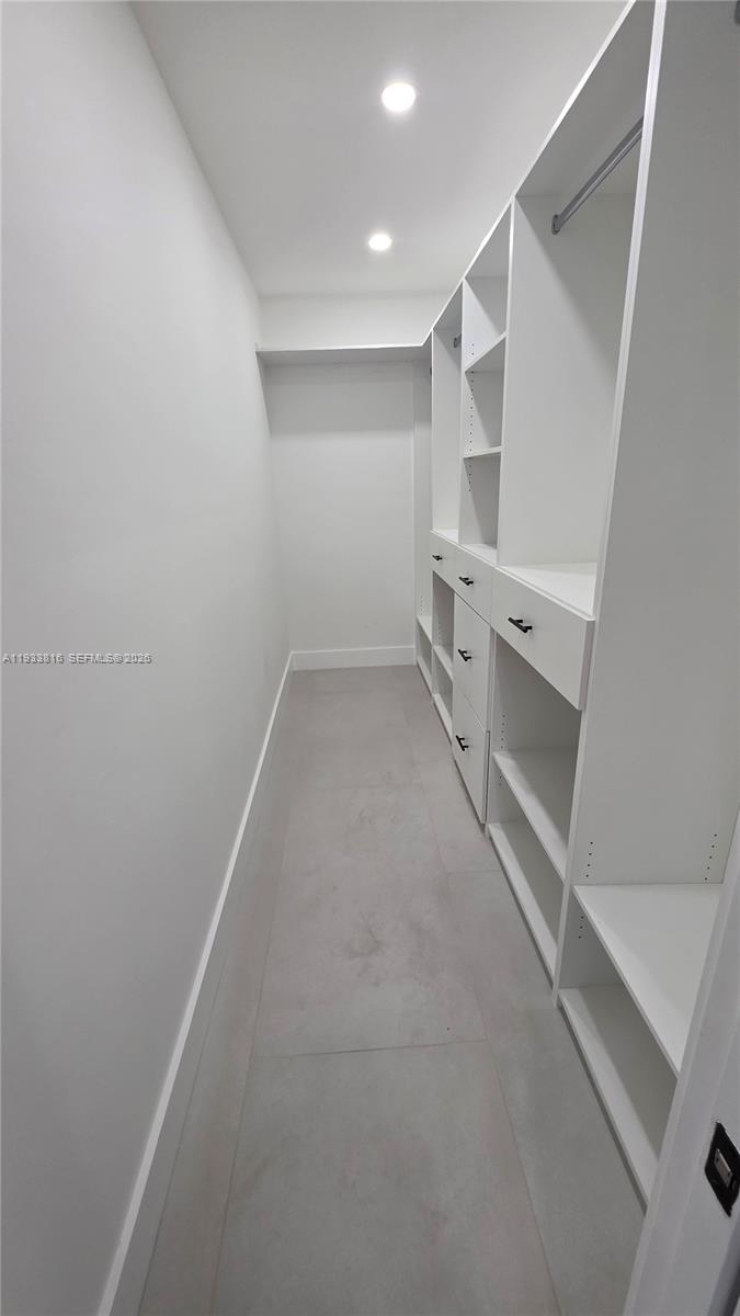10540 Southwest 125th Street Miami, FL 33176 - Photo 17 of 31 a view of storage and utility room with racks on the wall