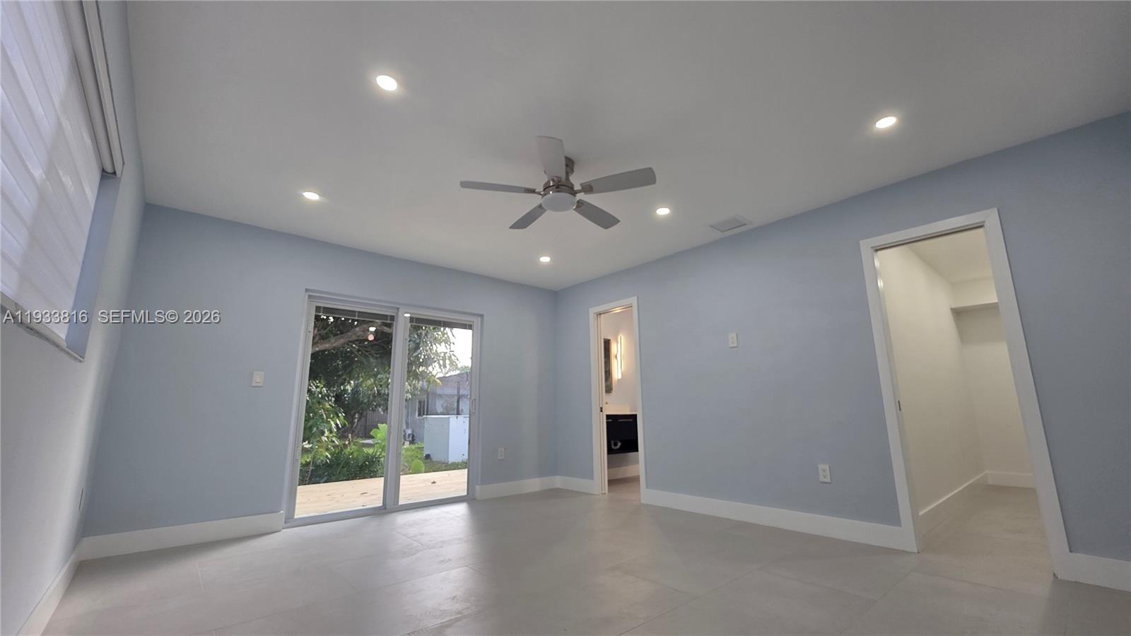 10540 Southwest 125th Street Miami, FL 33176 - Photo 20 of 31 wooden floor in an empty room with a window