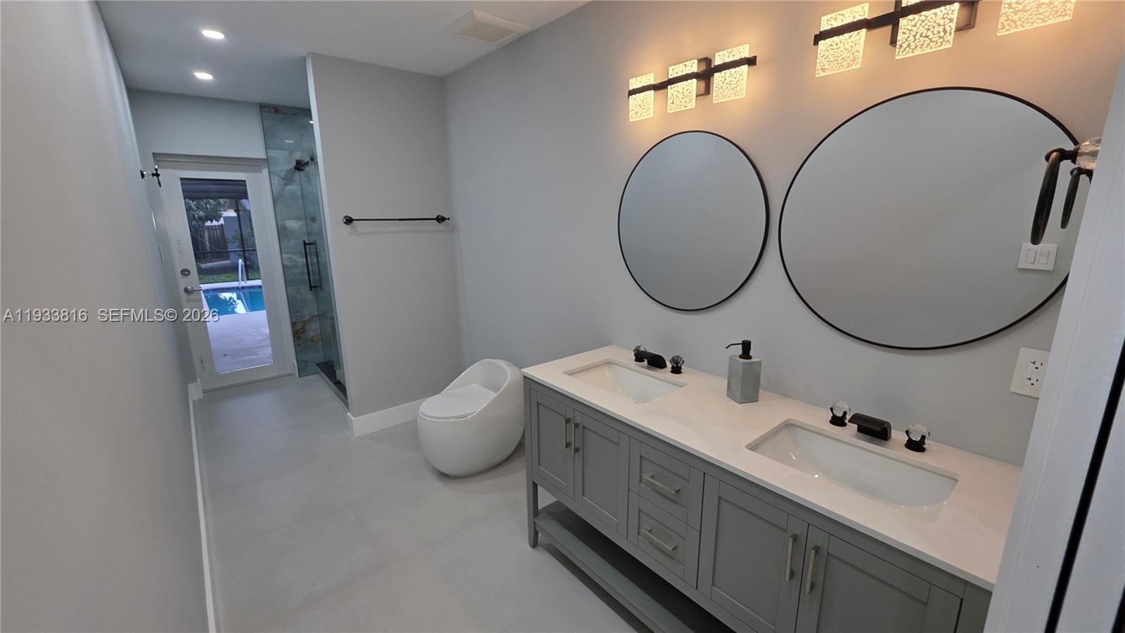 10540 Southwest 125th Street Miami, FL 33176 - Photo 21 of 31 a bathroom with a sink and a mirror