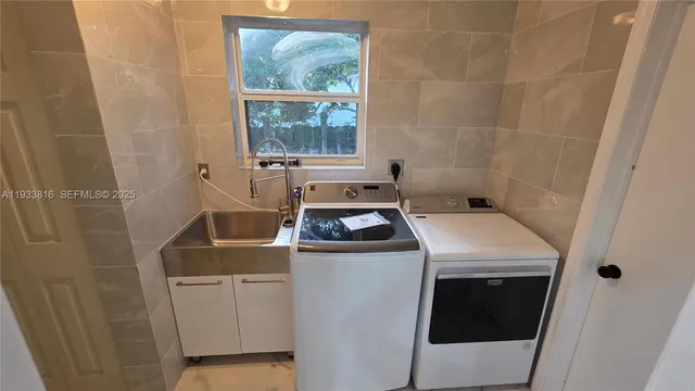 a utility room with dryer and washer