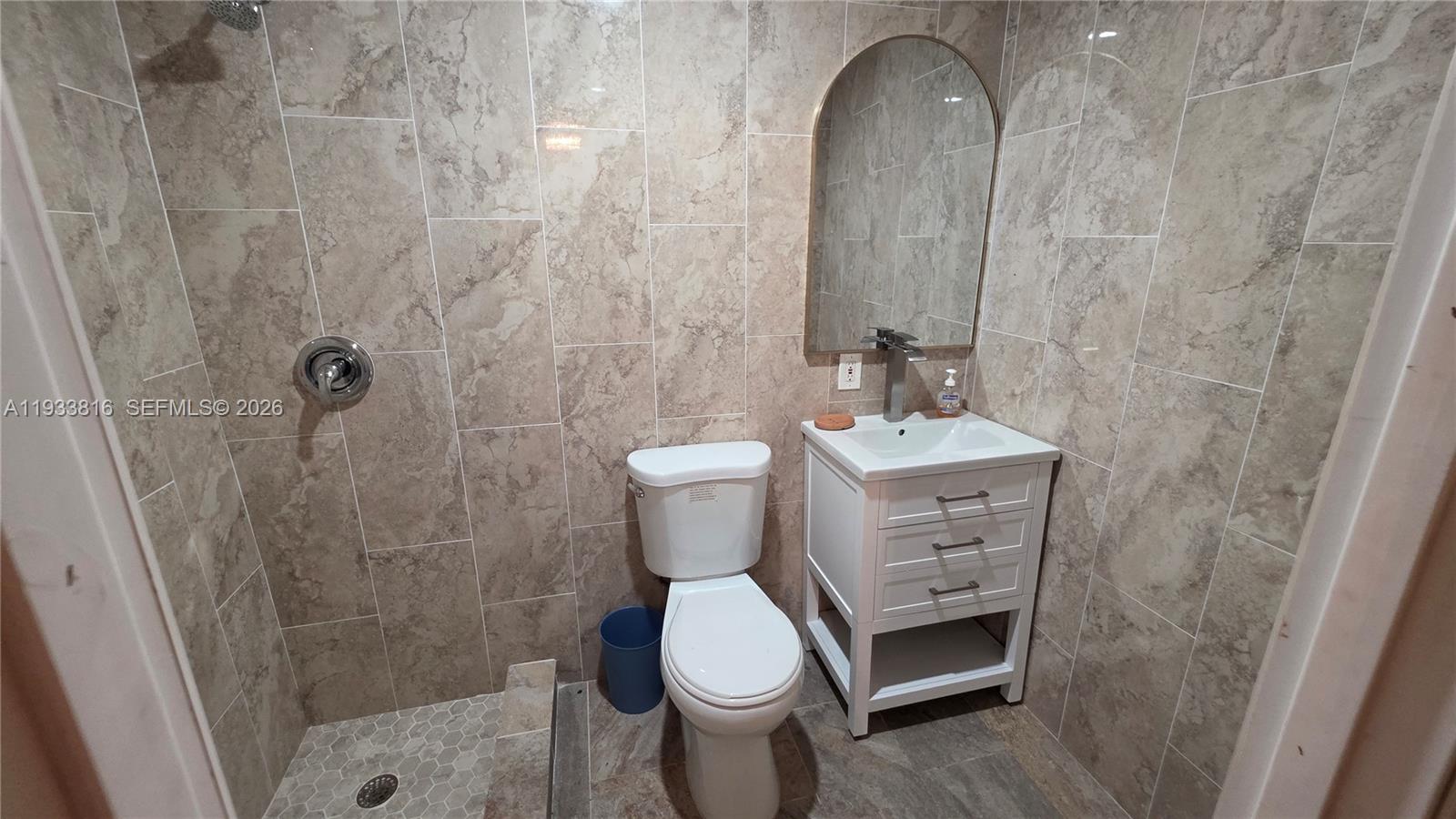 10540 Southwest 125th Street Miami, FL 33176 - Photo 30 of 31 a bathroom with a sink a toilet and shower