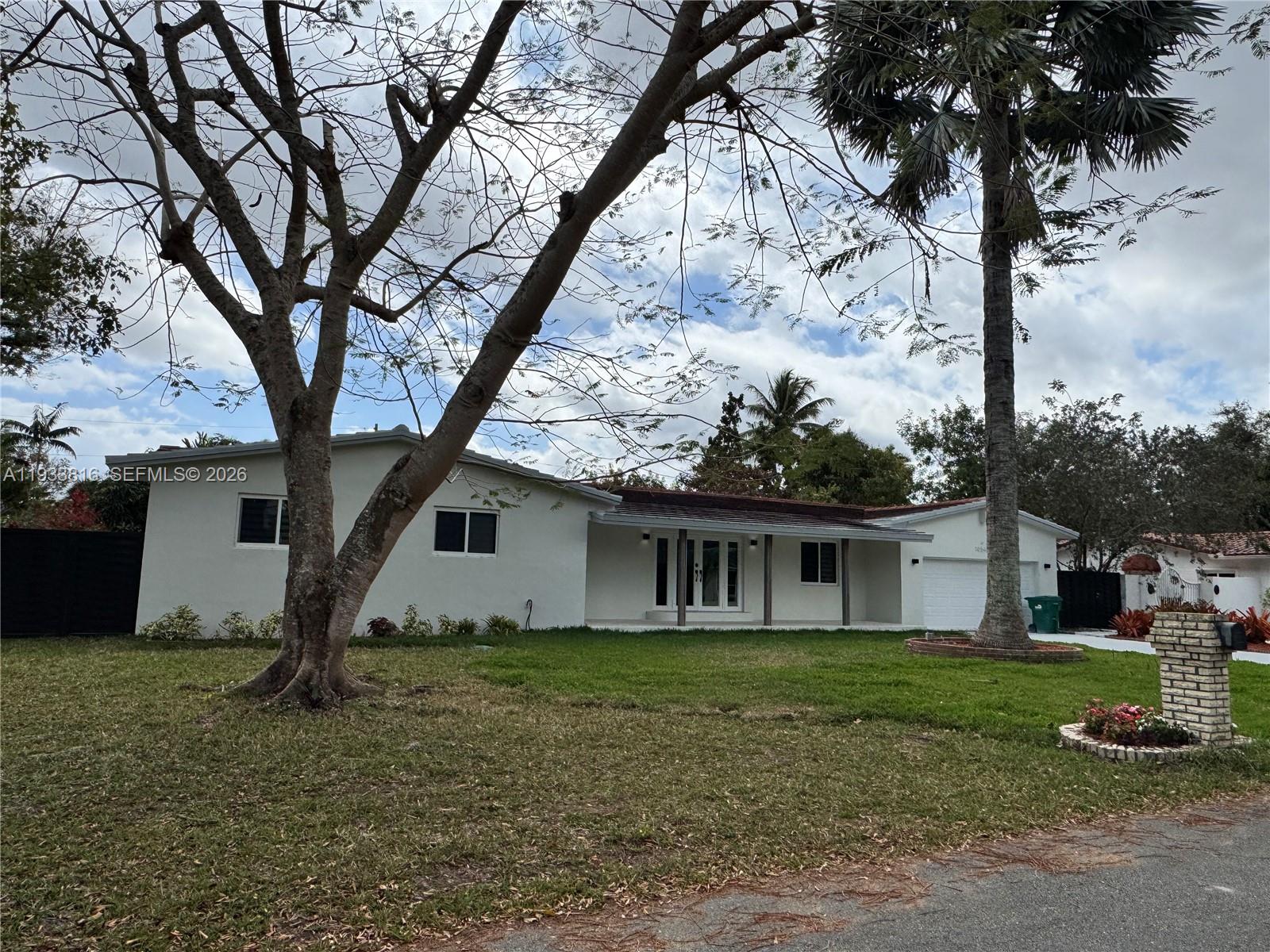 10540 Southwest 125th Street Miami, FL 33176 - Photo 3 of 31 a view of house with a yard