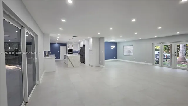 a view of a living room and entry way