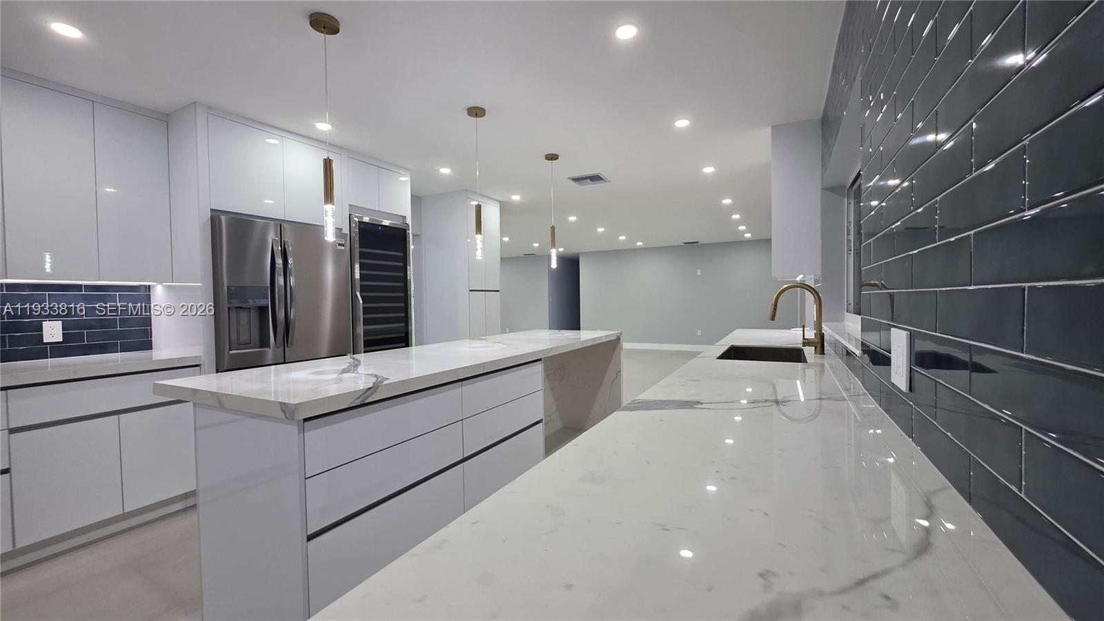 10540 Southwest 125th Street Miami, FL 33176 - Photo 10 of 31 a kitchen with stainless steel appliances a sink stove and cabinets