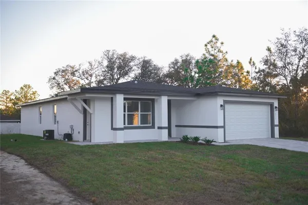 front view of house with a yard