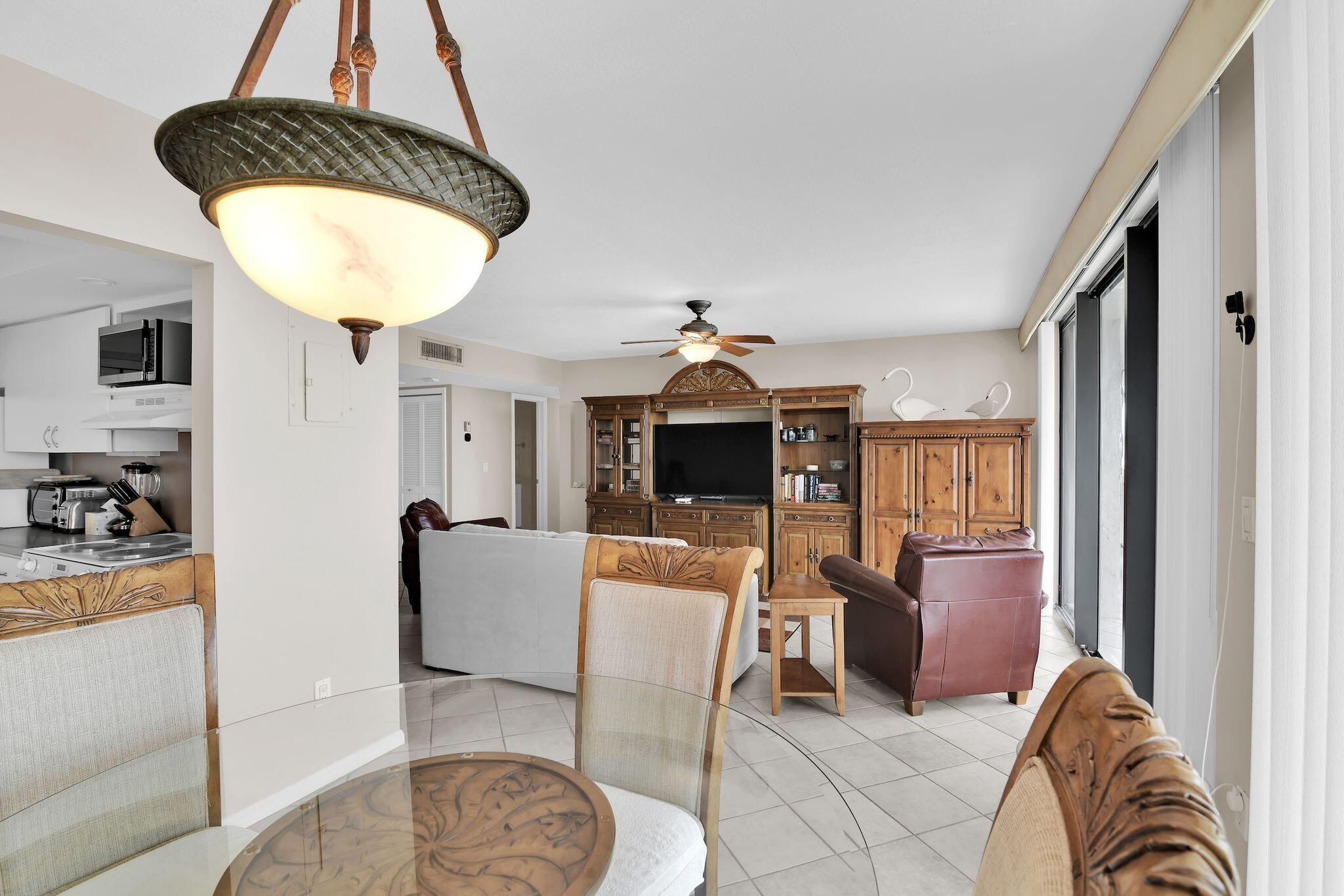 899 Jeffery Street, Unit 809 Boca Raton, FL 33487 - Photo 11 of 96 a living room with furniture a chandelier and a window