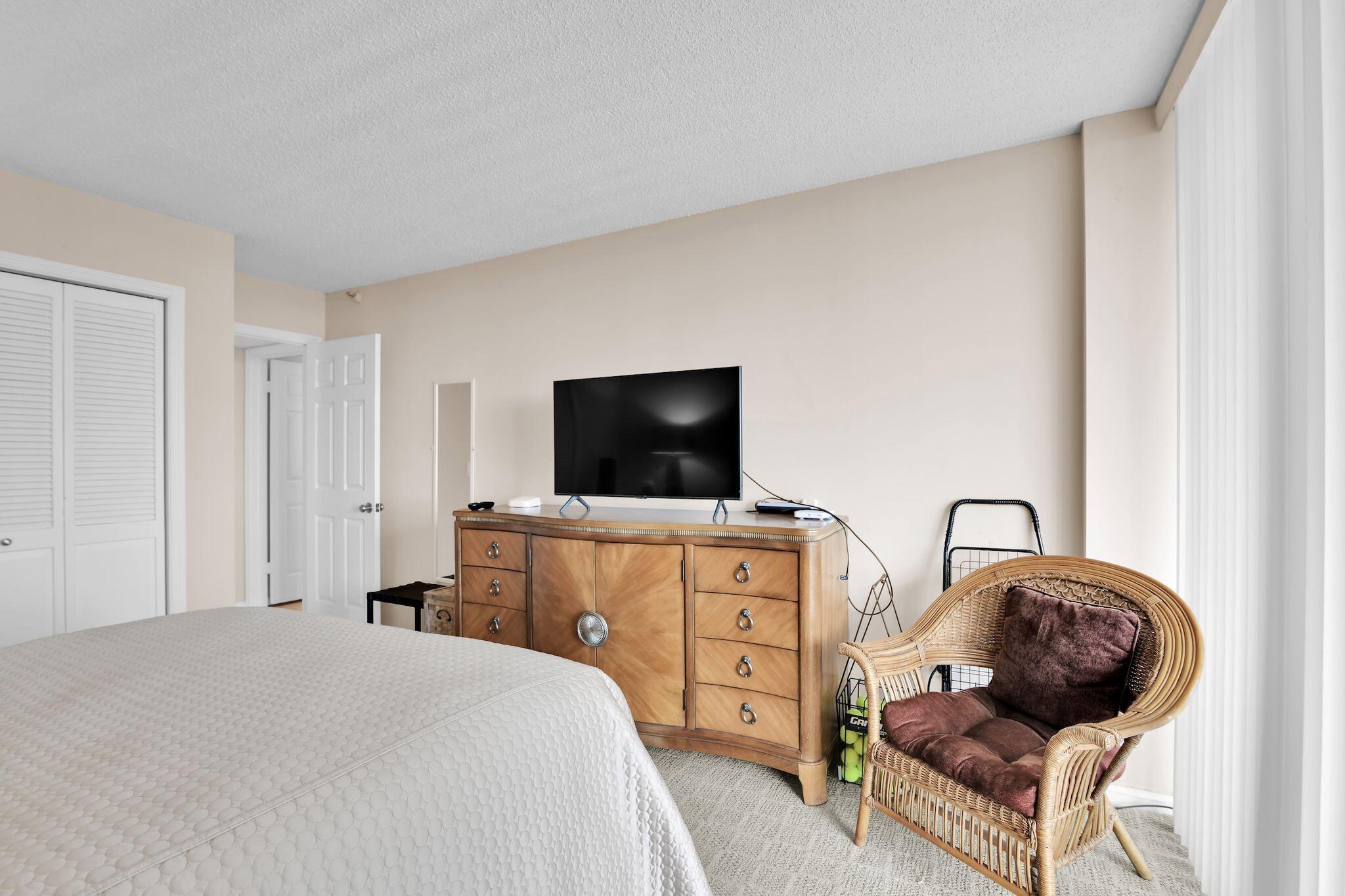 899 Jeffery Street, Unit 809 Boca Raton, FL 33487 - Photo 22 of 96 a bedroom with a bed and a television