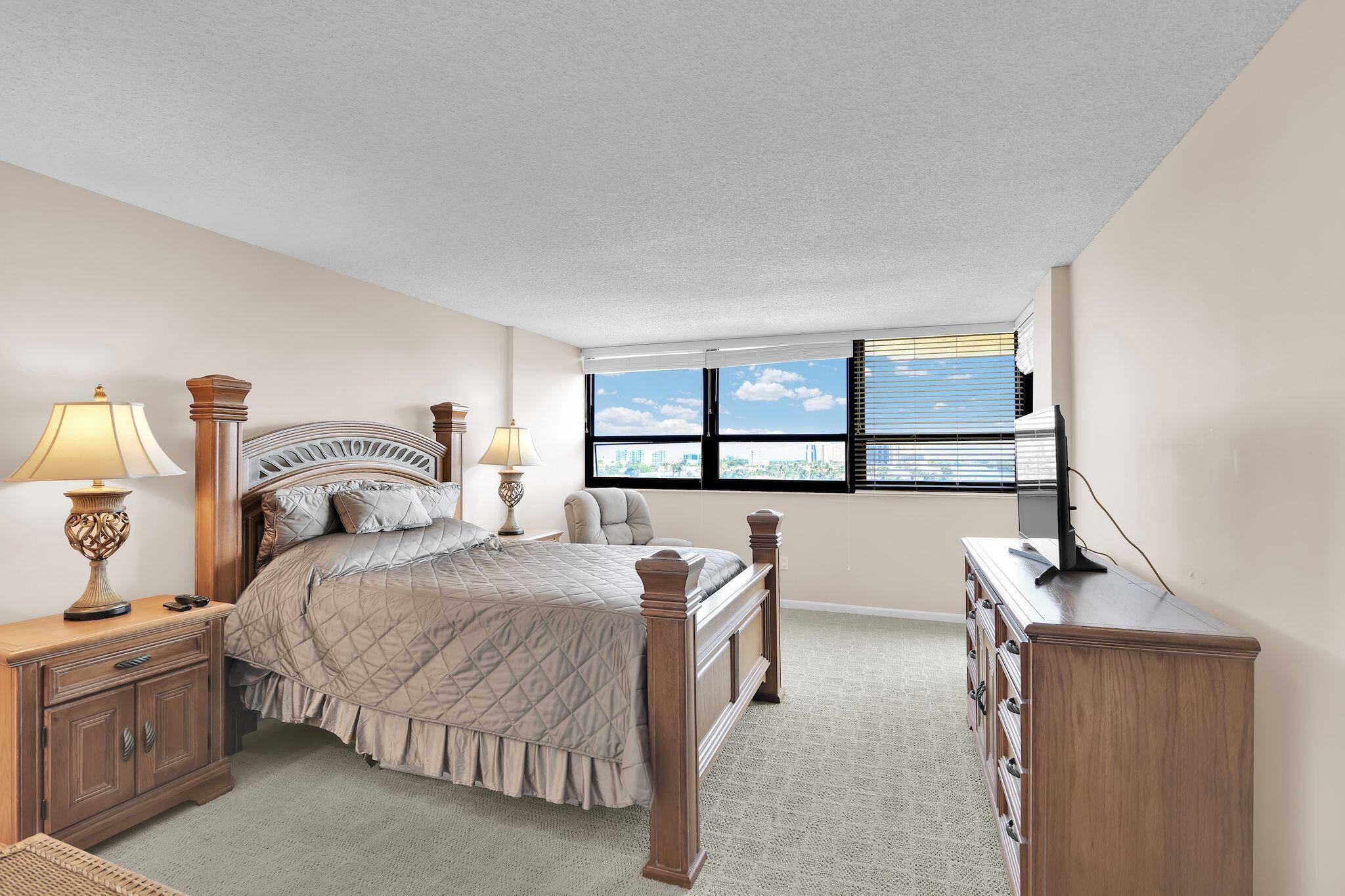 899 Jeffery Street, Unit 809 Boca Raton, FL 33487 - Photo 25 of 96 a bedroom with a bed and window