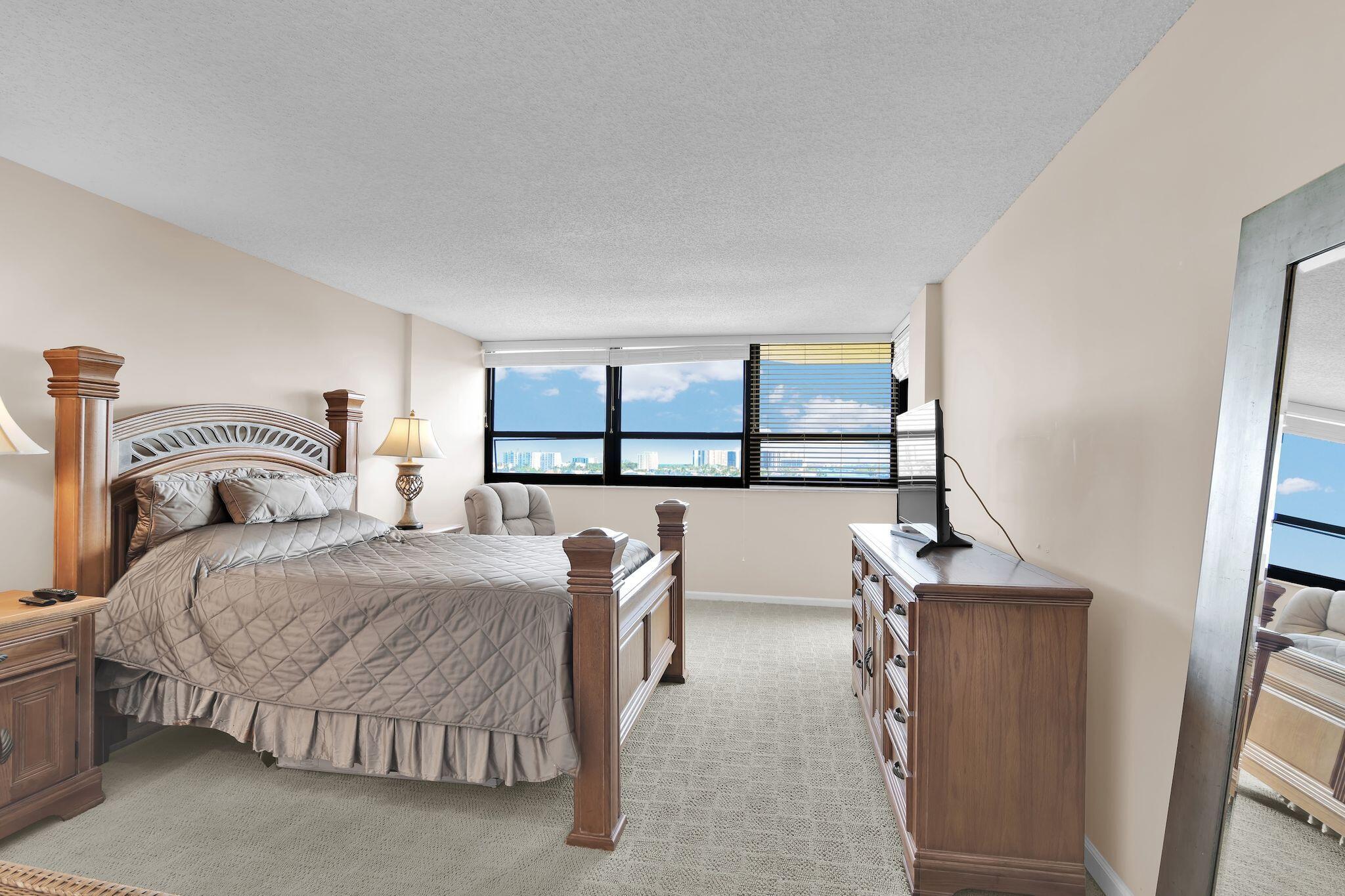 899 Jeffery Street, Unit 809 Boca Raton, FL 33487 - Photo 26 of 96 a bedroom with a bed and a window