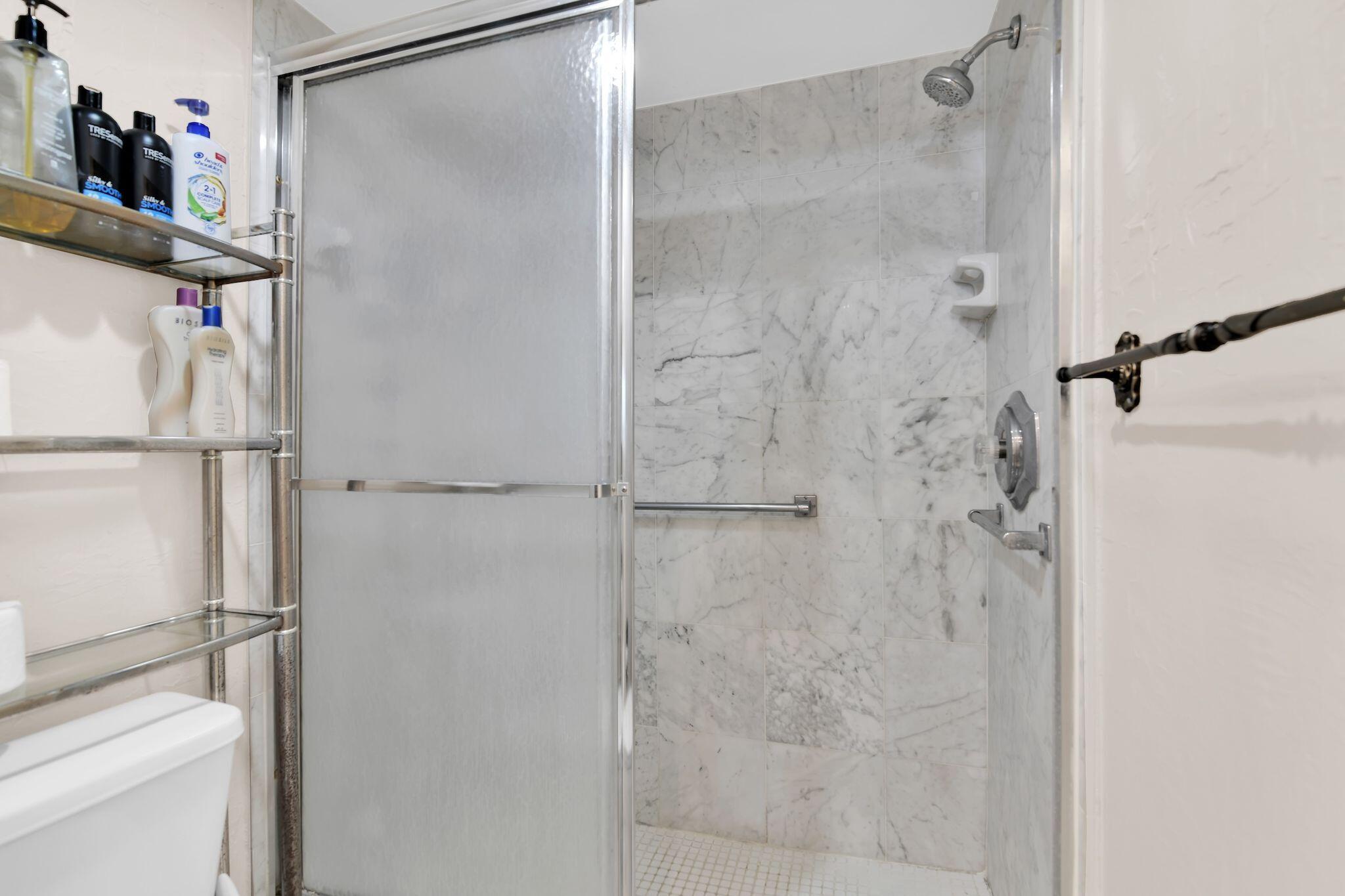 899 Jeffery Street, Unit 809 Boca Raton, FL 33487 - Photo 34 of 96 a bathroom with a shower and a sink