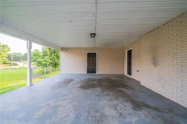 a view of a room with a large window