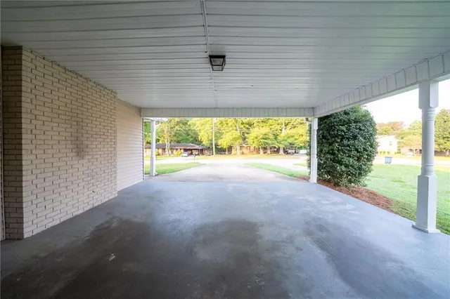 a view of yard with swimming pool and green space