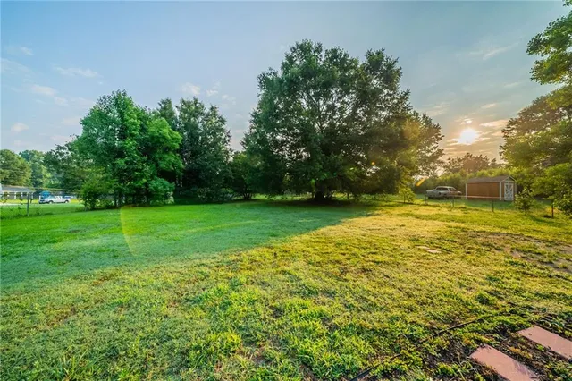 a backyard of a house with lots of green space