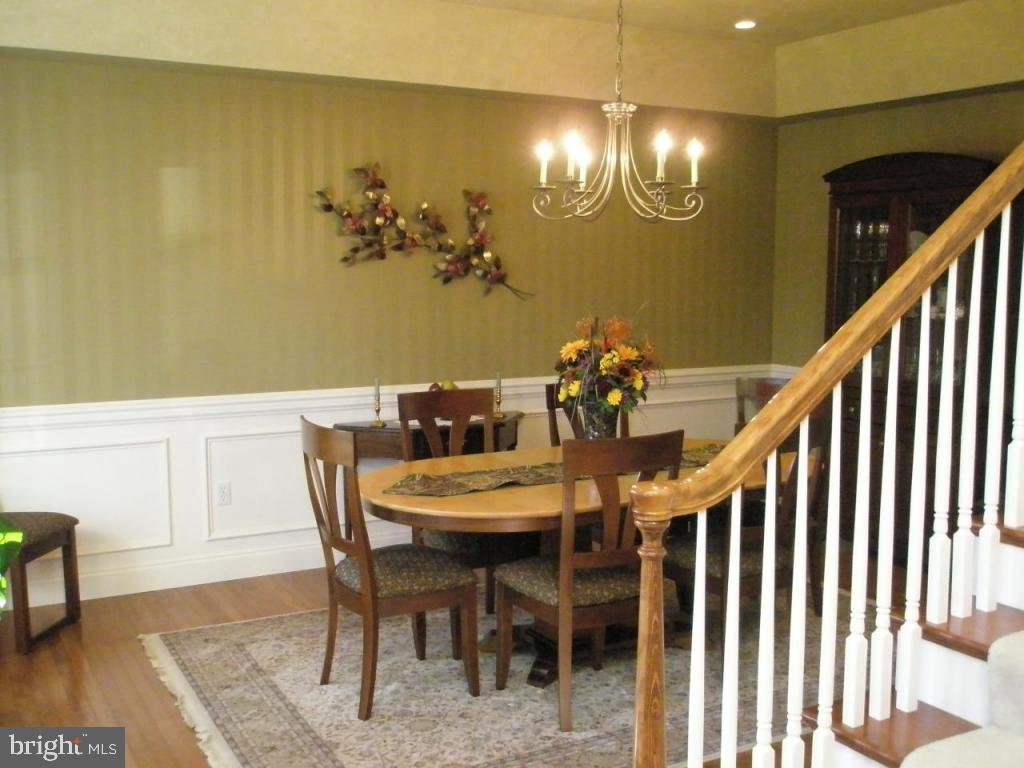 3008 Weaver Road Lititz, PA 17543 - Photo 7 of 12 a view of a dining room with furniture and wooden floor