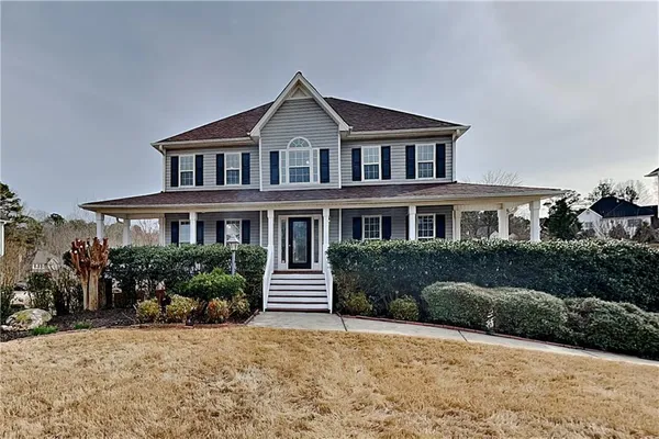 a front view of a house with a yard