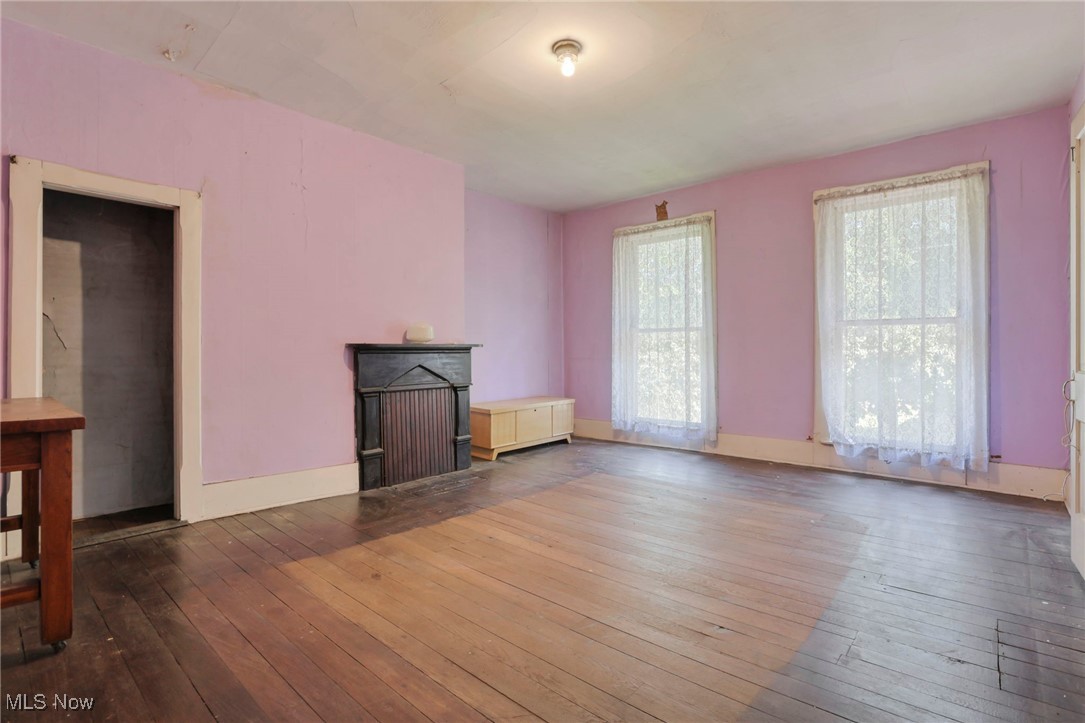 21372 Bridgewater Road Quaker City, OH 43773 - Photo 27 of 39 Unfurnished living room with hardwood / wood-style flooring