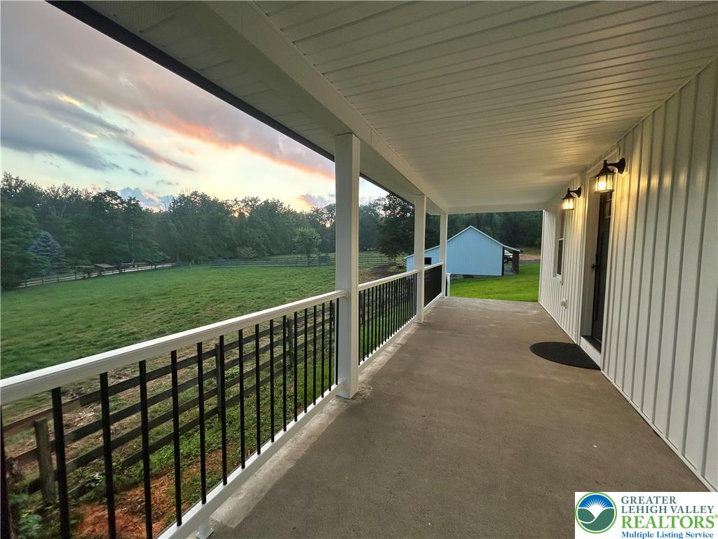 72 Allegheny Road Mount Bethel, PA 18343 - Photo 41 of 72 A spacious covered porch offers tranquil pasture views and stunning evening skies.