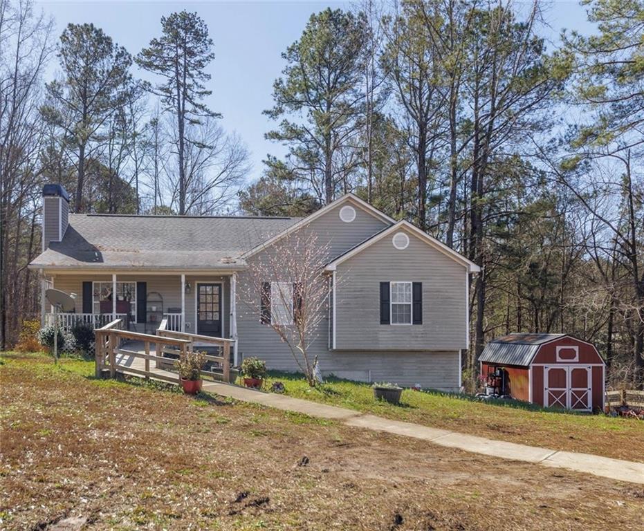 11100 Bells Ferry Road Canton, GA 30114 - Photo 1 of 1 a view of a house with a yard and large tree