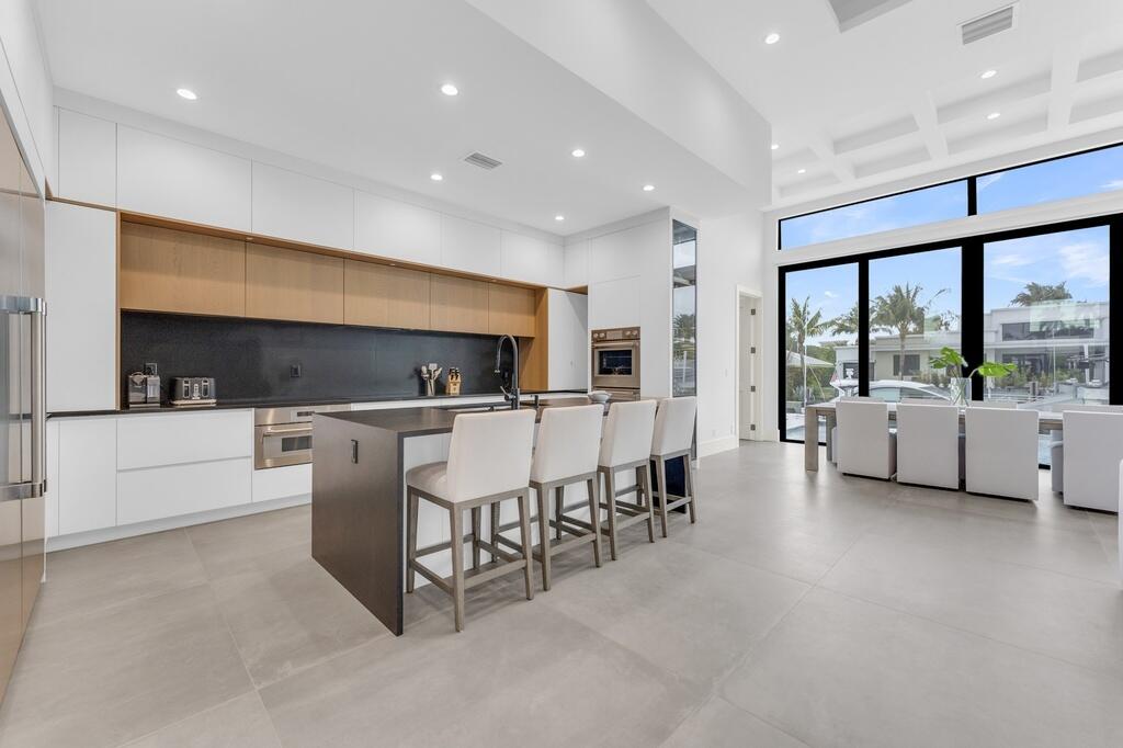 923 Eve Street Delray Beach, FL 33483 - Photo 15 of 69 a living room with furniture and a large window
