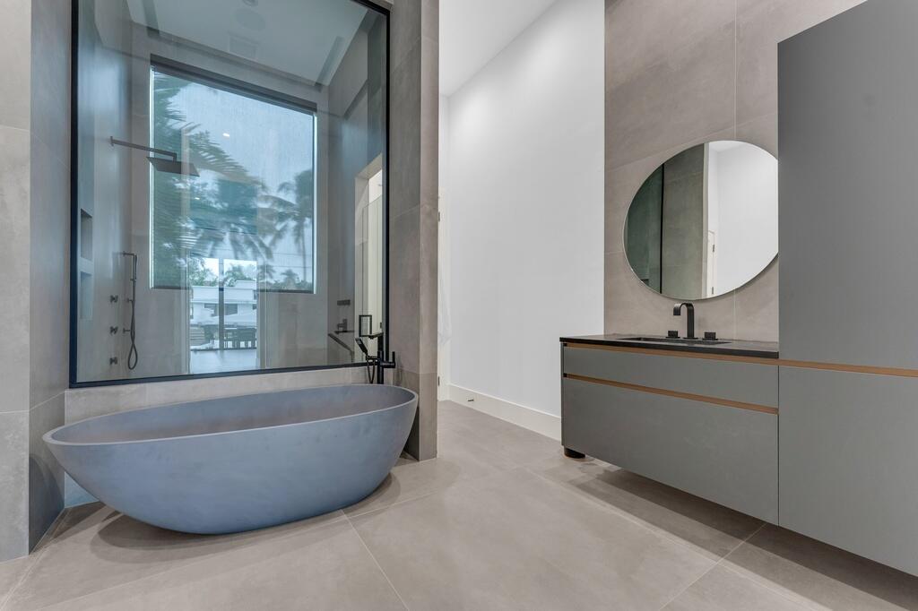 923 Eve Street Delray Beach, FL 33483 - Photo 23 of 69 a bathroom with a bathtub and window