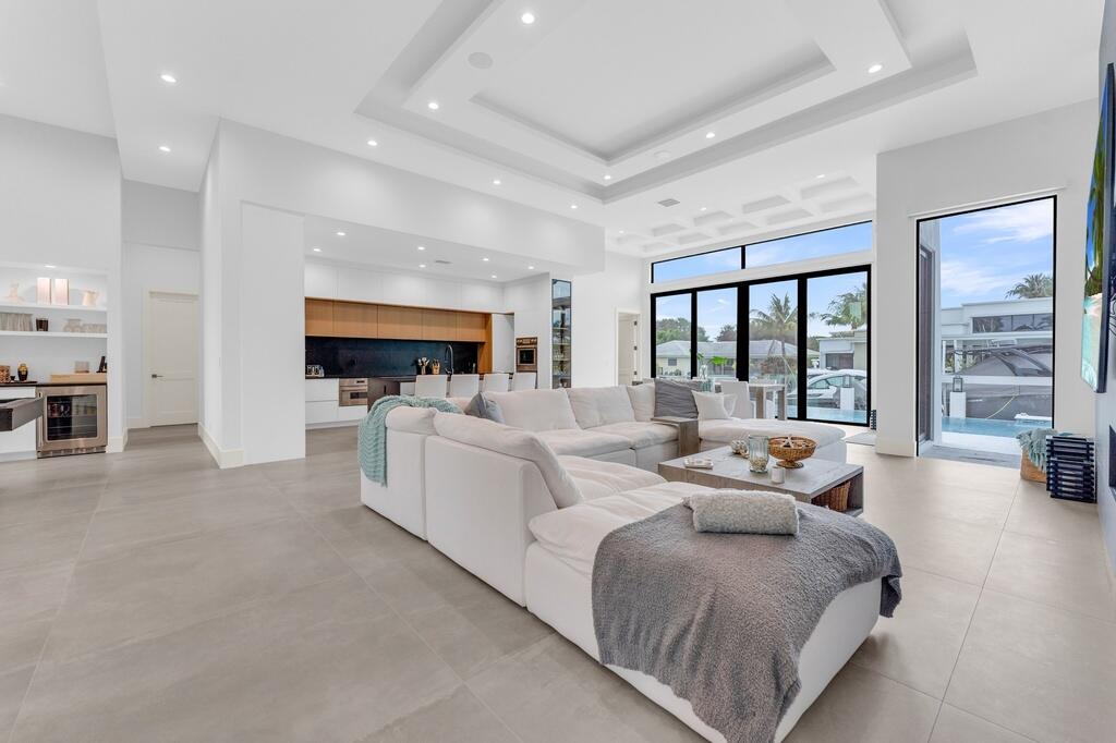 923 Eve Street Delray Beach, FL 33483 - Photo 8 of 69 a large white bed sitting in a room next to a large window