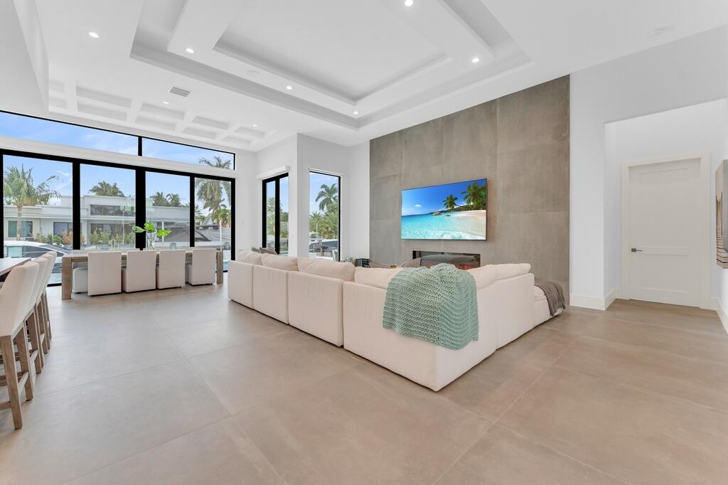 923 Eve Street Delray Beach, FL 33483 - Photo 9 of 69 a living room with furniture and a large window