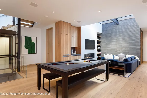 a room with furniture and air hockey table