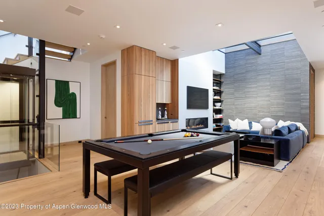 a room with furniture and air hockey table