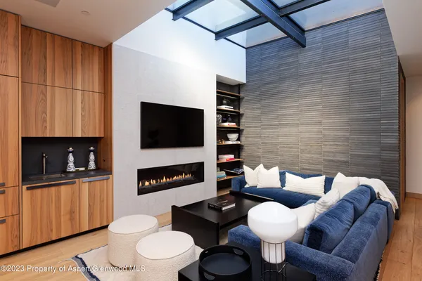 a bedroom with a bed and painting on the wall