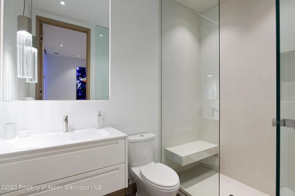 a bathroom with a bathtub a sink and mirror
