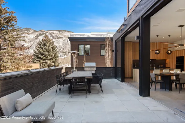 a patio with patio couch and chairs
