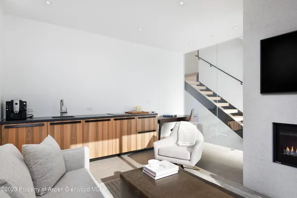 a view of table and with a book shelf