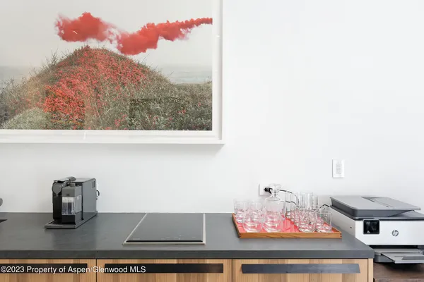 a bedroom with a bed and a large mirror